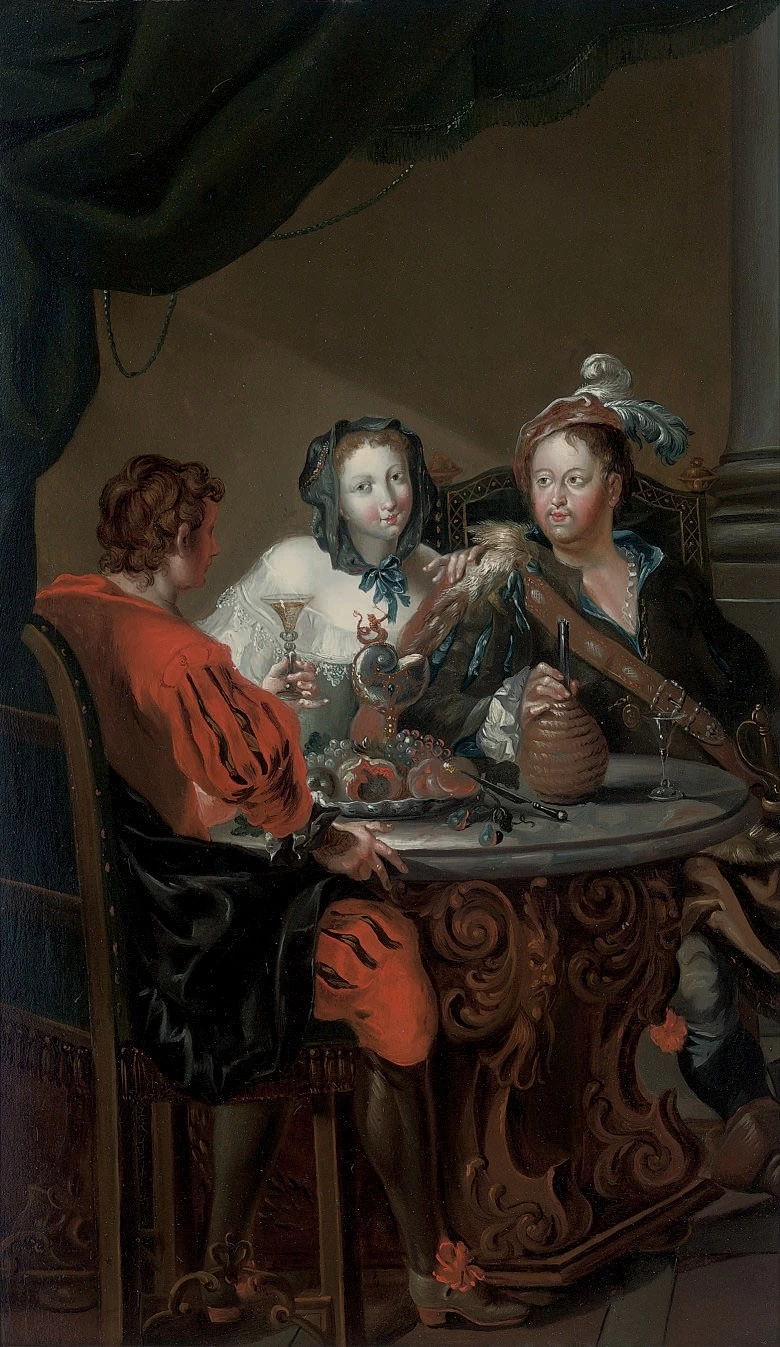 Un'elegante compagnia a tavola